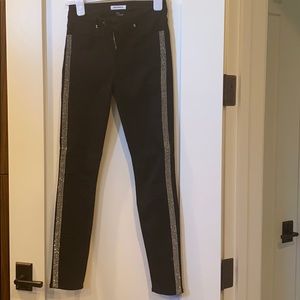 Black skinny jeans with rhinestone stripe
